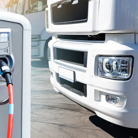 truck; electric; charging; station; transportation; fleet; cargo; lorry; transport; delivery; white; car; vehicle; trailer; freight; shipping; industry; business; logistic; trucking; big; heavy; semi; clean; energy; zero; emission; charge; renewable energy; power; technology; socket; cable